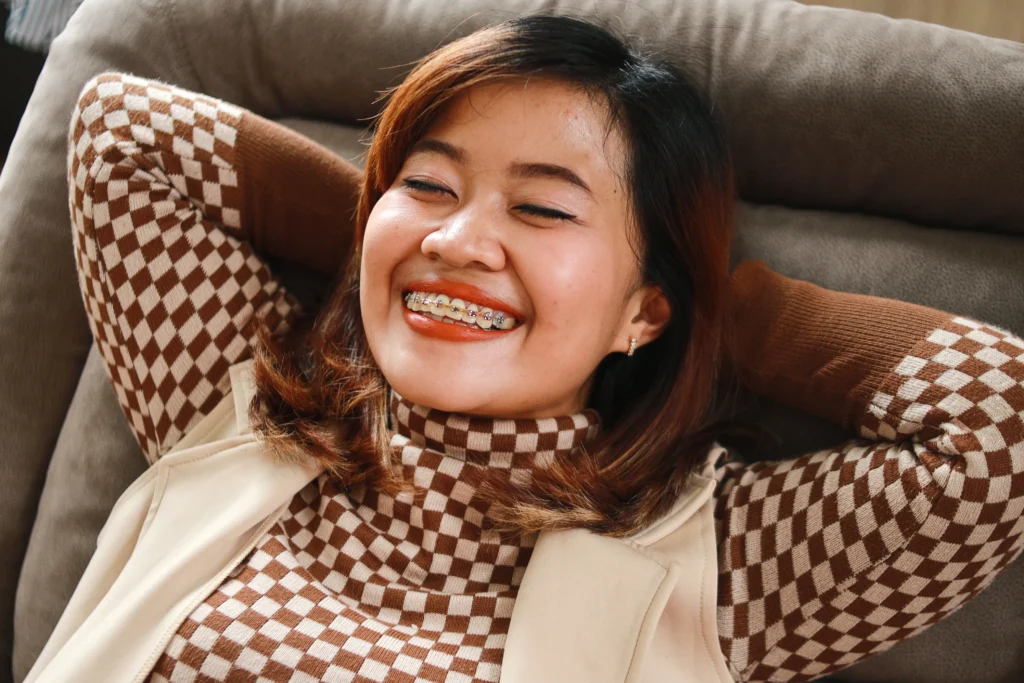 Does Braces Hurt? 4 does braces hurt woman wearing braces klinik pergigian prima senawang